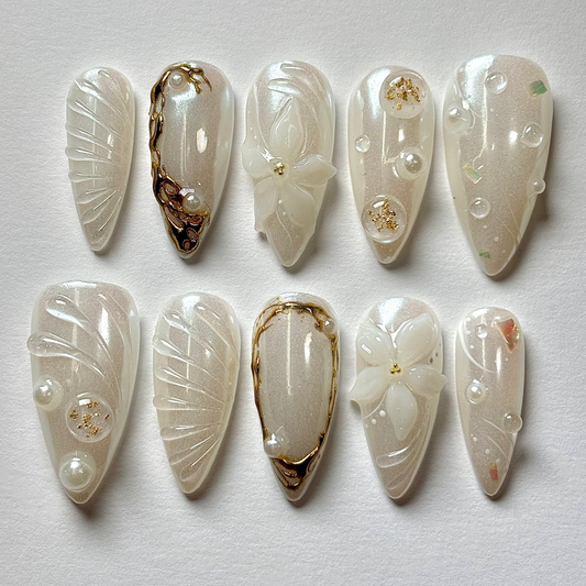 Set of decorative nail art tips on a light gray background