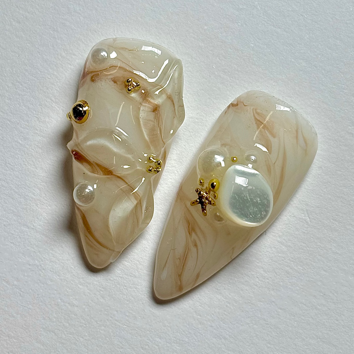 Pair of decorative earrings on a light gray background