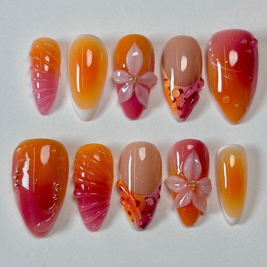 Set of nail art designs with gradient colors and butterfly decorations on a white background